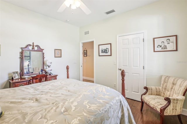 bedroom with dark wood-type flooring and ceiling fan