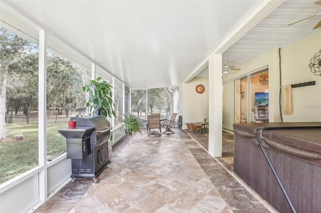 sunroom / solarium with ceiling fan