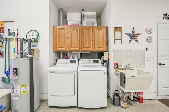 laundry area with cabinets, washer and clothes dryer, sink, and water heater