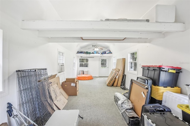 interior space with cooling unit, ceiling fan, carpet flooring, and lofted ceiling with beams