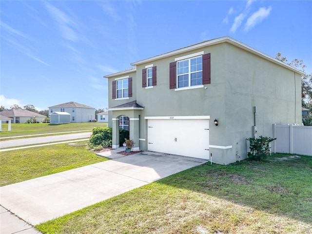 view of front of home featuring a front yard and a garage