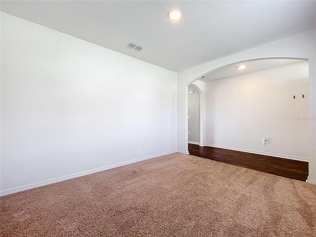 unfurnished room with hardwood / wood-style floors