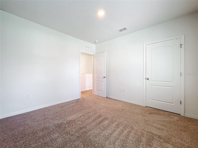 unfurnished bedroom with carpet floors