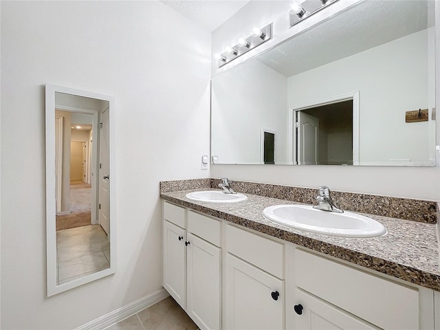 bathroom featuring tile patterned floors and vanity