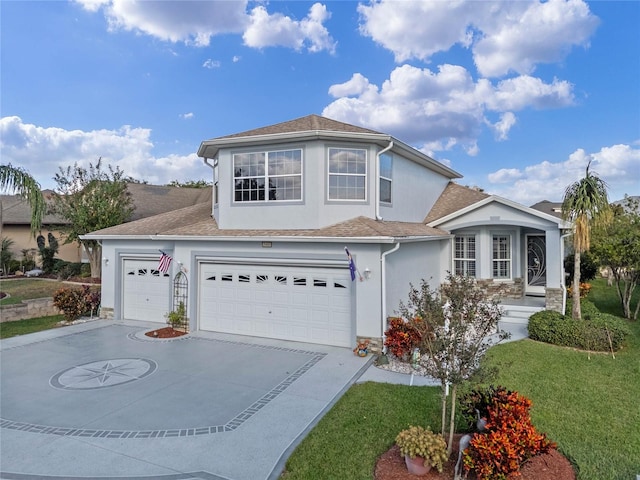 view of front property featuring a front lawn and a garage