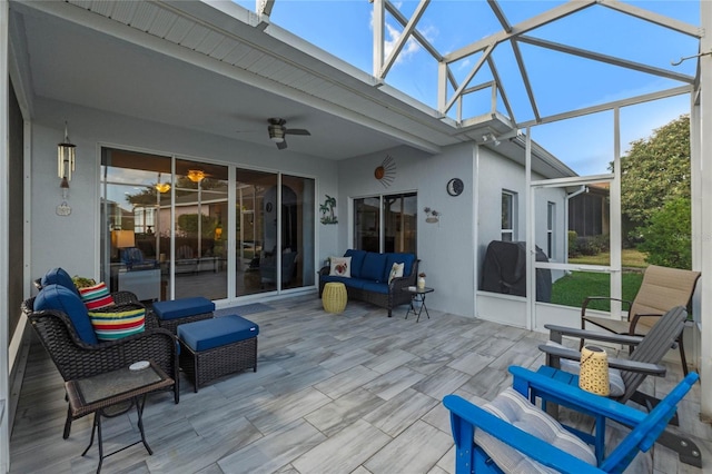 sunroom / solarium featuring ceiling fan