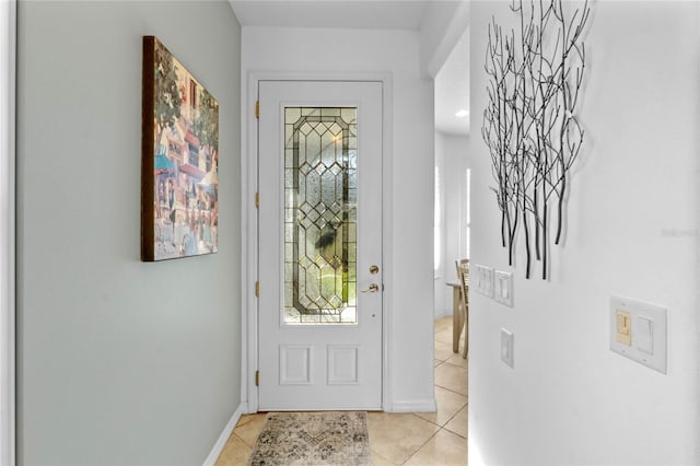 foyer entrance featuring light tile patterned flooring