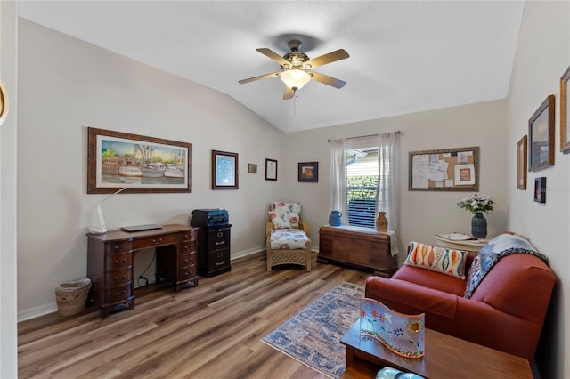 sitting room featuring ceiling fan, hardwood / wood-style floors, and lofted ceiling