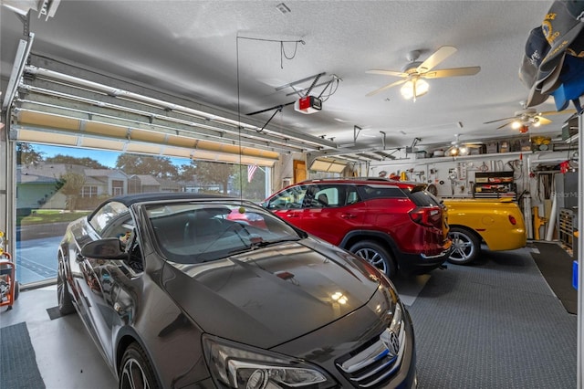 garage with a garage door opener and ceiling fan