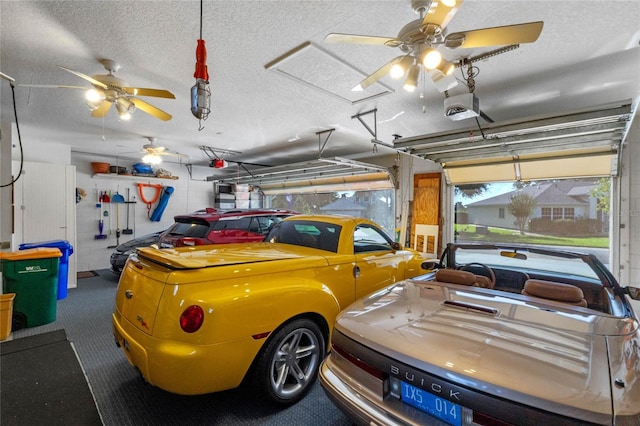 garage with ceiling fan and a garage door opener