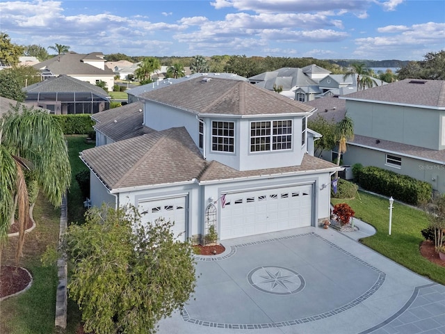 view of front of house featuring a front yard and a garage