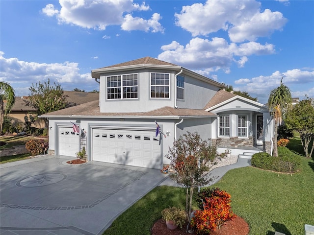 front of property featuring a garage and a front lawn