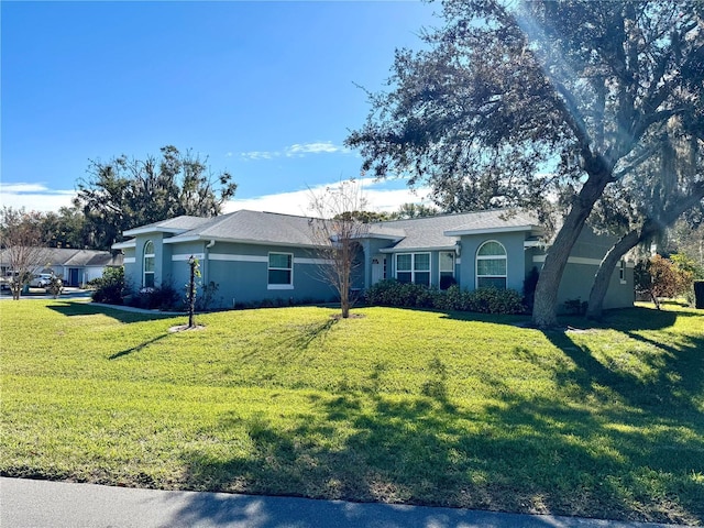 ranch-style house with a front lawn