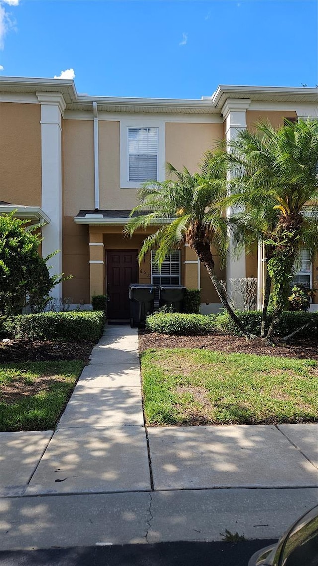 652 Chelsea Dr, Davenport, FL 33897 - view of front of house with stucco siding