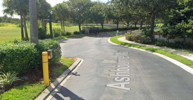 652 Chelsea Dr, Davenport, FL 33897 - view of asphalt road featuring curbs and sidewalks