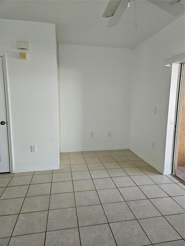 652 Chelsea Dr, Davenport, FL 33897 - empty room featuring light tile patterned flooring, a ceiling fan, and baseboards