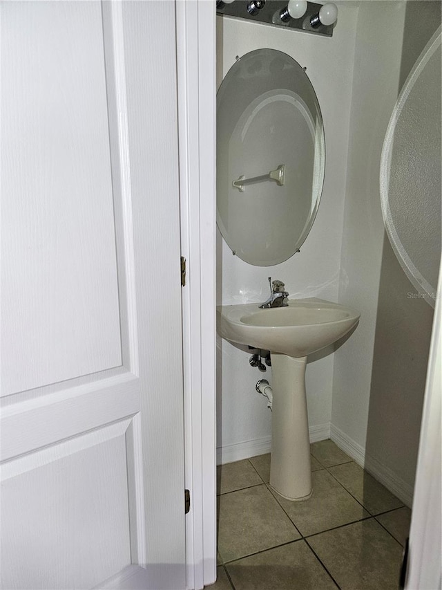 bathroom with tile patterned floors