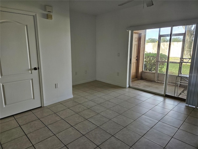 652 Chelsea Dr, Davenport, FL 33897 - empty room featuring a ceiling fan, tile patterned floors, and baseboards