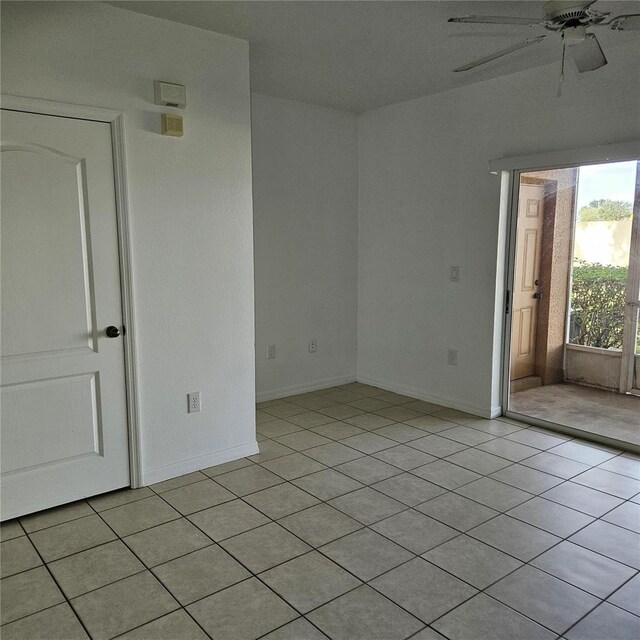 652 Chelsea Dr, Davenport, FL 33897 - empty room with ceiling fan, light tile patterned floors, and baseboards