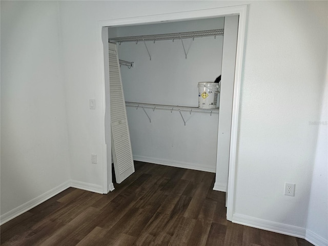 spacious closet with dark hardwood / wood-style floors