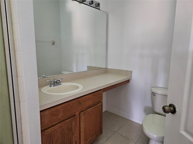 bathroom featuring tile patterned floors, vanity, and toilet