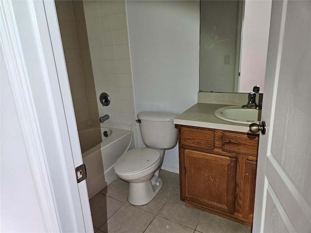 full bathroom featuring tile patterned floors, tiled shower / bath, vanity, and toilet