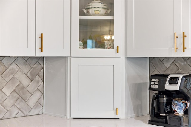 interior details with white cabinets and backsplash