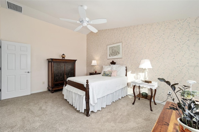 bedroom with ceiling fan and light colored carpet