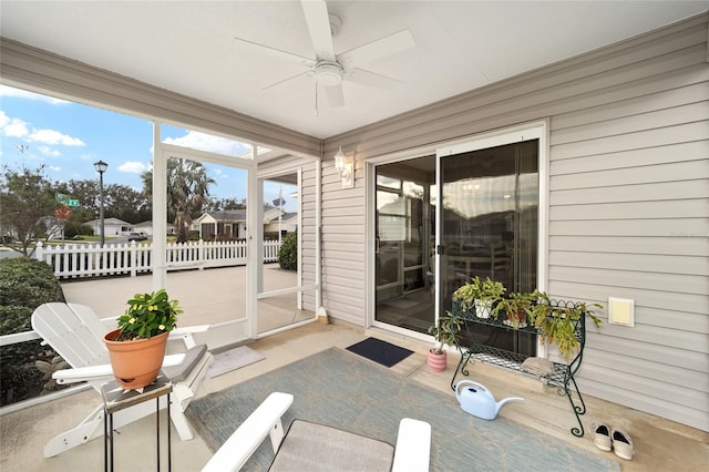 sunroom / solarium with ceiling fan