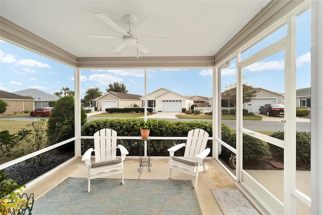 sunroom featuring ceiling fan