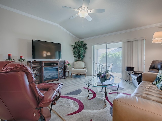 living room featuring ceiling fan, vaulted ceiling, light hardwood / wood-style floors, and crown molding