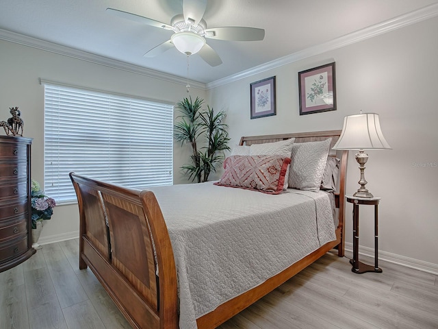 bedroom with ornamental molding, ceiling fan, and light hardwood / wood-style floors