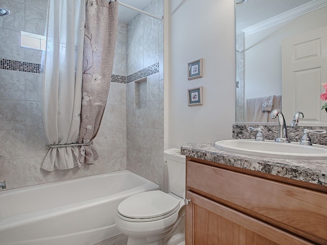 full bathroom featuring toilet, vanity, and shower / bath combo with shower curtain