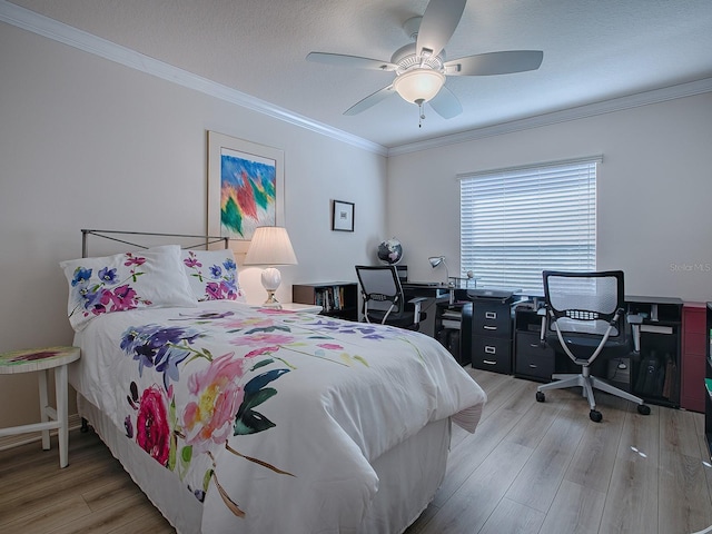 bedroom featuring ornamental molding, ceiling fan, and light hardwood / wood-style flooring