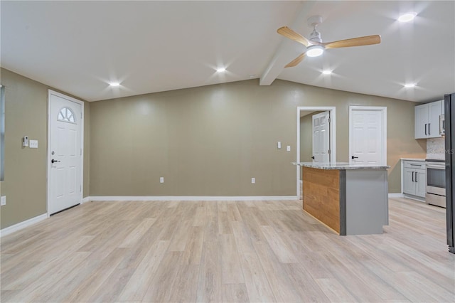 kitchen with electric stove, light stone counters, light hardwood / wood-style flooring, and a center island