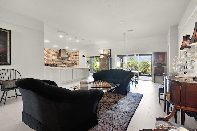 tiled living room featuring sink