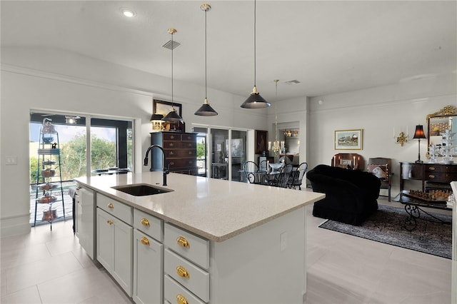 kitchen with dishwasher, sink, hanging light fixtures, an island with sink, and light stone counters