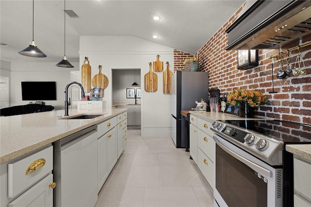 kitchen with stainless steel appliances, white cabinets, decorative light fixtures, and custom exhaust hood