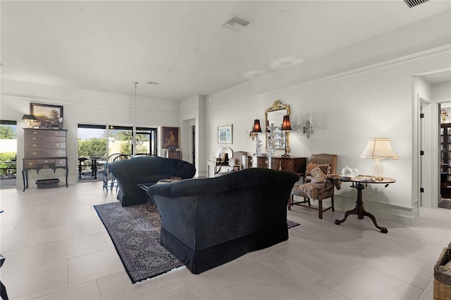 living area with light tile patterned floors and visible vents