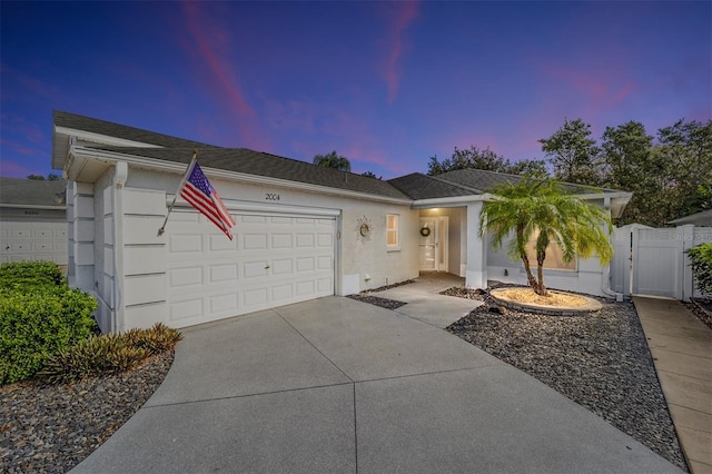 ranch-style house featuring a garage