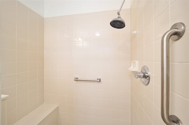 bathroom with a tile shower