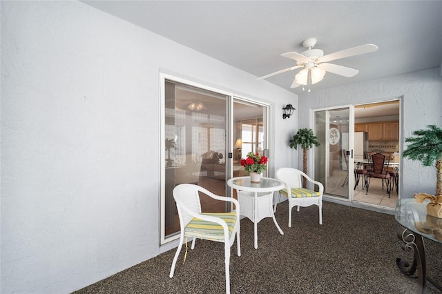 dining room with carpet and ceiling fan