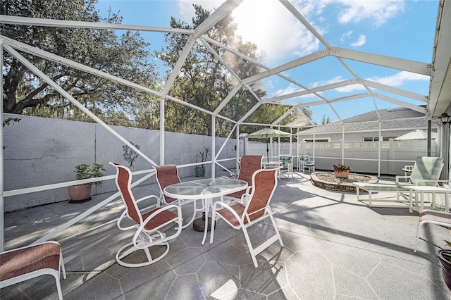 view of patio / terrace with a lanai