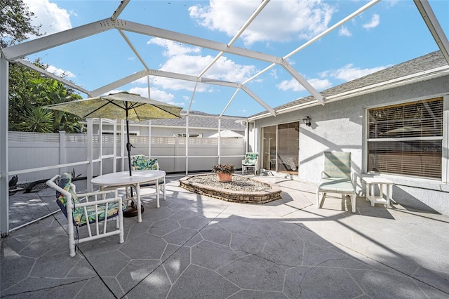 view of patio featuring a lanai