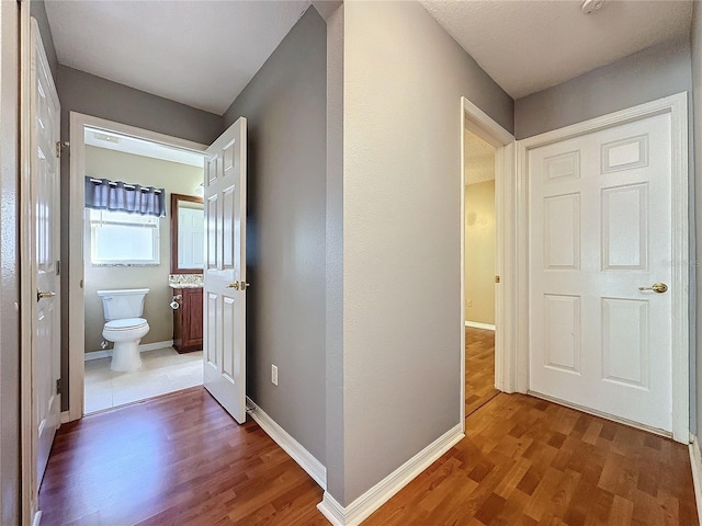 corridor featuring dark hardwood / wood-style floors