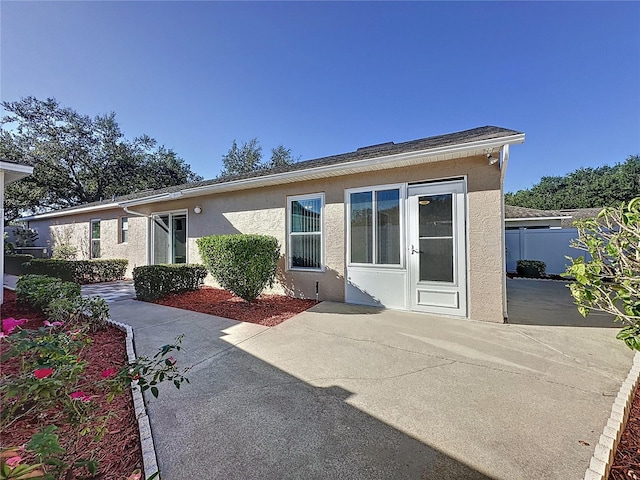 rear view of property featuring a patio