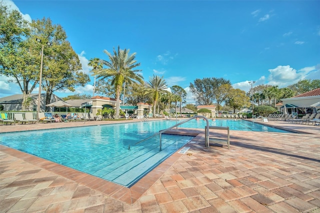 view of swimming pool featuring a patio area