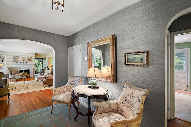 sitting room with hardwood / wood-style flooring