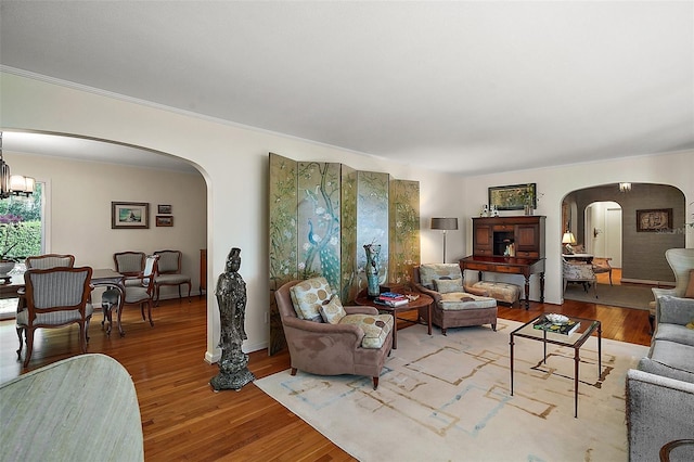 living room featuring a notable chandelier and hardwood / wood-style flooring