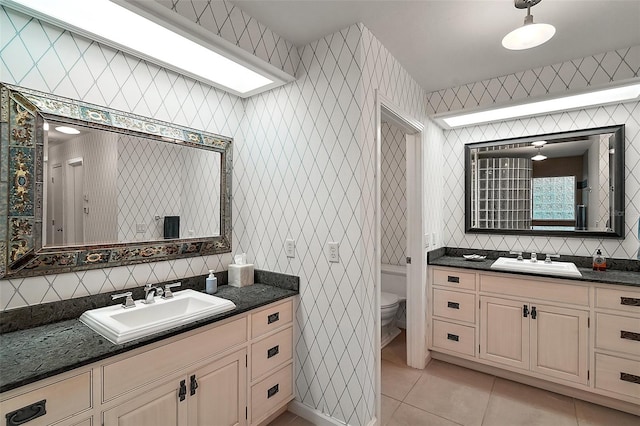 bathroom featuring tile patterned flooring, vanity, tasteful backsplash, and toilet